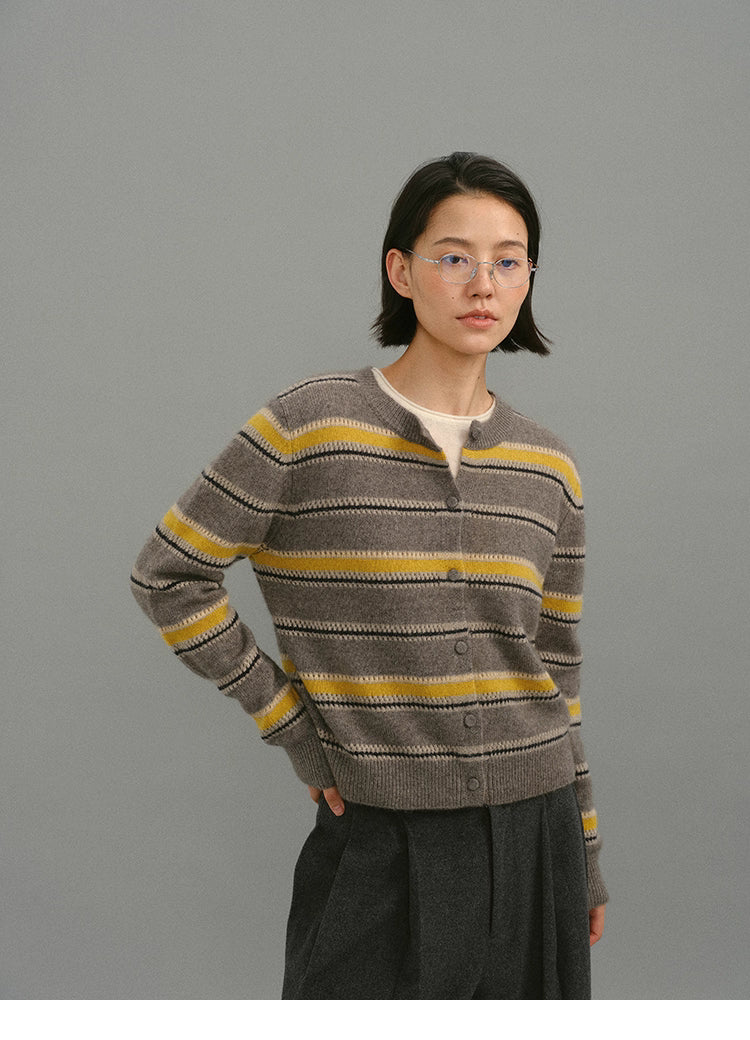 Front portrait view of the taupe-yellow striped crewneck cardigan, showing the button-up design and soft knit texture.