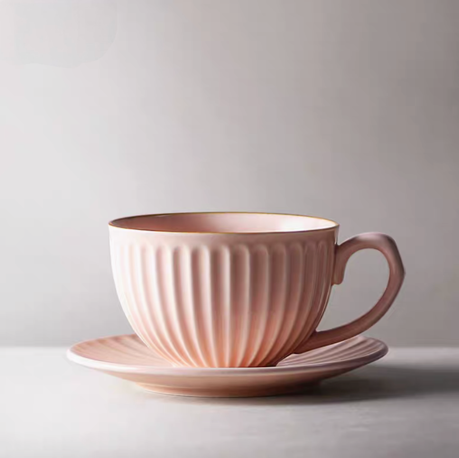 Pink striped ceramic cappuccino art cup and saucer in clean product view with soft glossy finish and ribbed texture