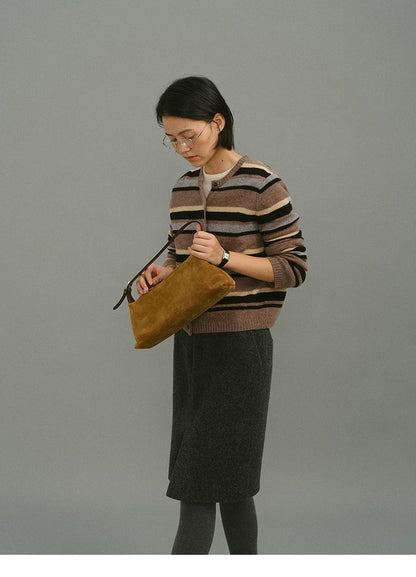 Mocha stripe wool cardigan, side view with bag