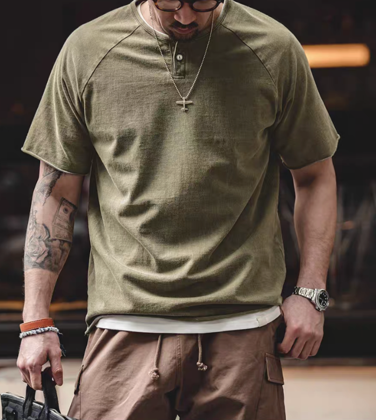Style Washed Henley T-Shirt Green front worn view showing vintage washed cotton fabric quarter placket button detail and relaxed fit