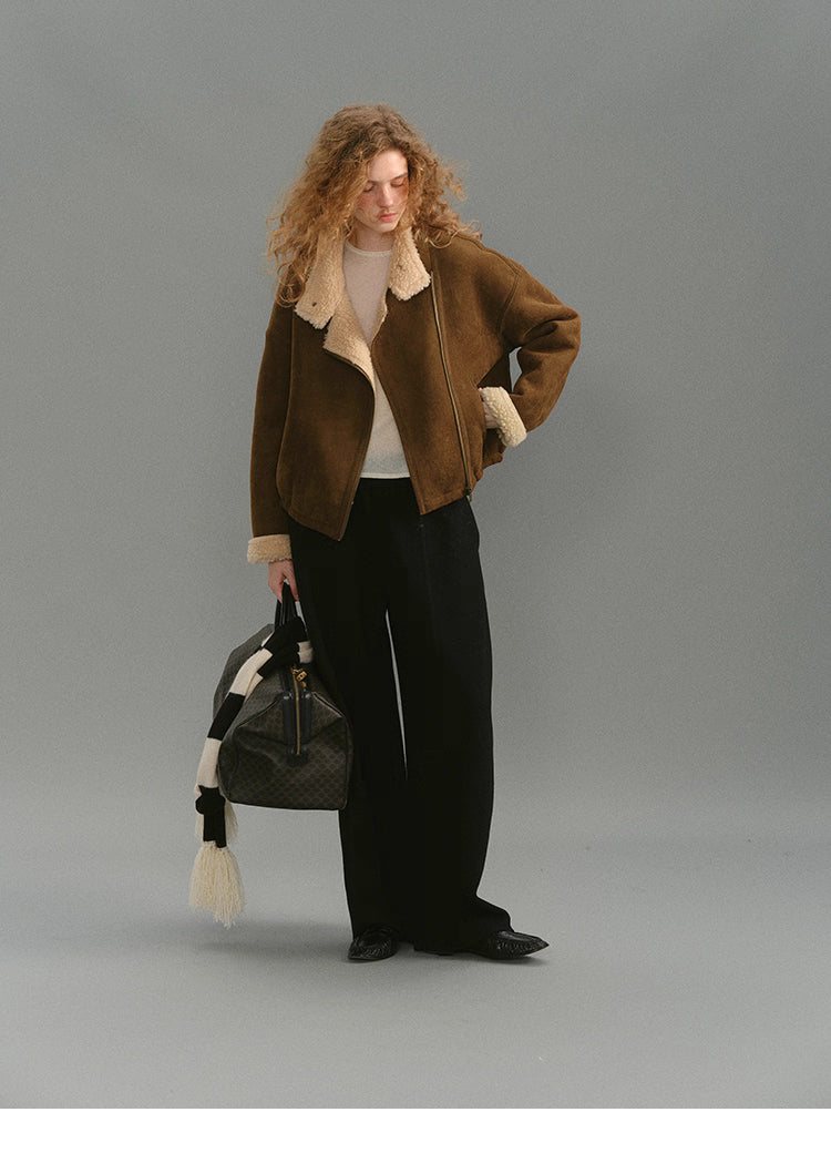 Full-body look featuring caramel suede shearling jacket and wide-leg pants.