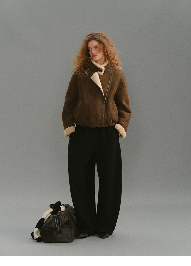 Full-body neutral-toned outfit with caramel suede shearling jacket.