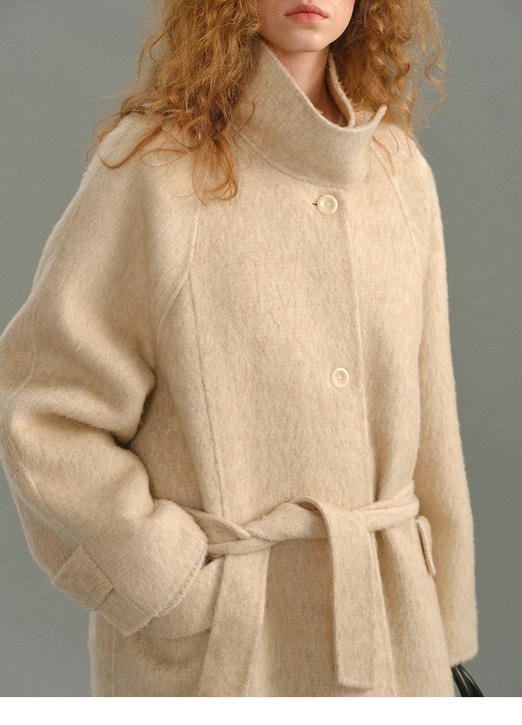 Detailed shot of the coat’s chest area with single-breasted buttons and soft brushed finish.