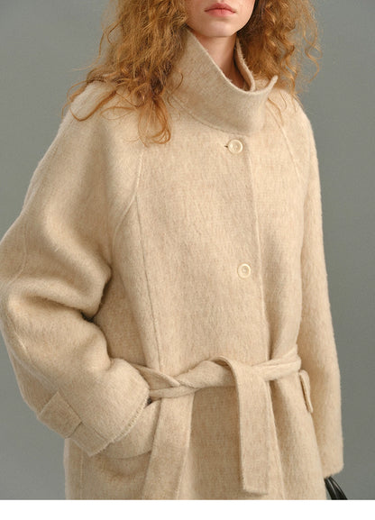 Detailed shot of the coat’s chest area with single-breasted buttons and soft brushed finish.