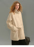 Front view of the SuriBlend oatmeal wrap coat with stand collar and belt tied loosely.