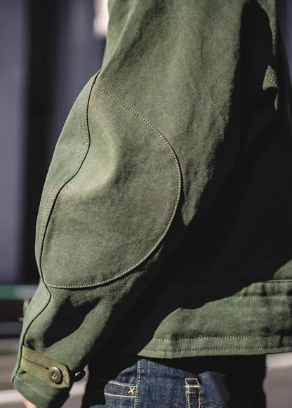 Reinforced elbow patch detail on Swedish military motorcycle jacket – durable canvas construction.