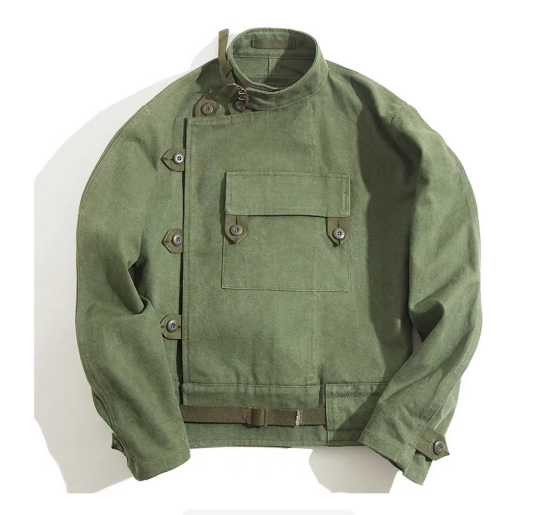 Men’s Swedish military motorcycle jacket in green canvas – front flat lay view showing asymmetrical design and chest pocket.