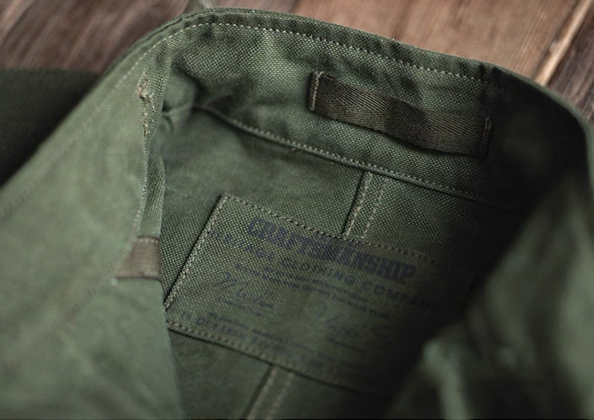 Interior label and stitching detail of Swedish military motorcycle jacket – heritage workwear style.