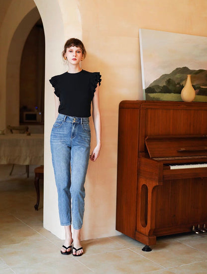 Black ruffle sleeveless top full body outfit styled with jeans for a chic casual everyday look