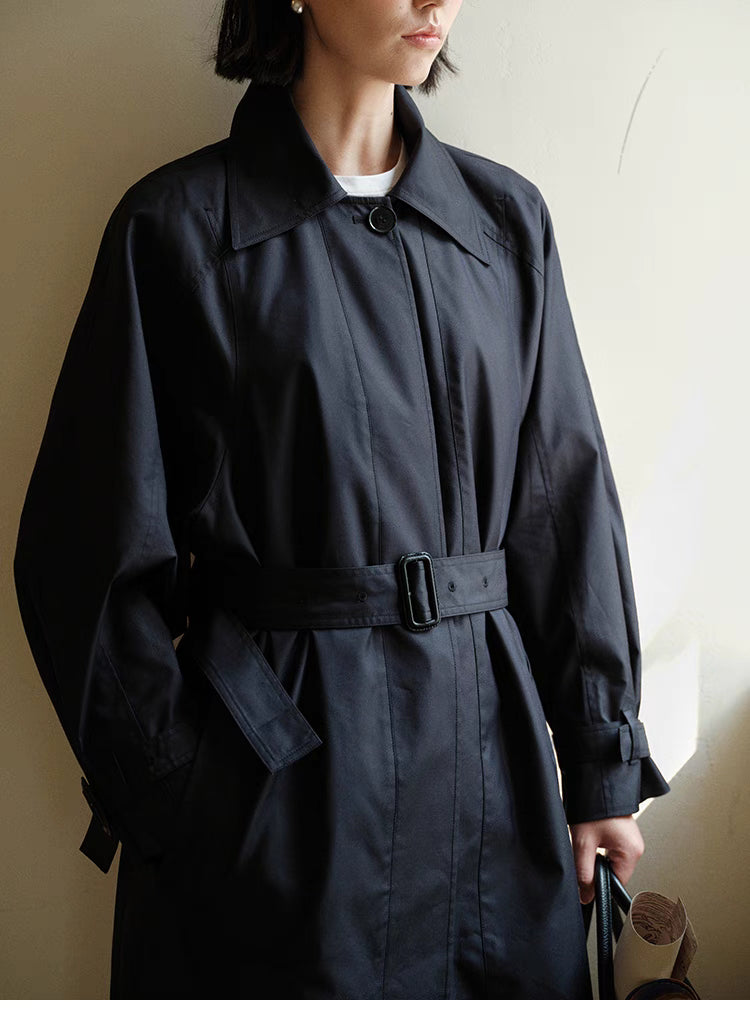 Front close-up of Dark Navy Blue Tailored Belted Trench Coat showing belt buckle detail, concealed button placket and smooth fabric finish