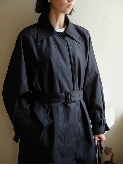 Front close-up of Dark Navy Blue Tailored Belted Trench Coat showing belt buckle detail, concealed button placket and smooth fabric finish