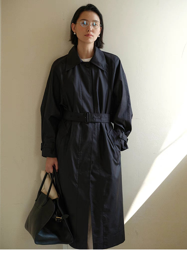 Tailored Belted Trench Coat with Convertible Collar in Dark Navy Blue full body front view showing belted waist, single-breasted design and sleek long silhouette