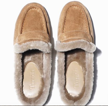 Top view of tan shearling-lined mules showing the loafer strap and cushioned footbed