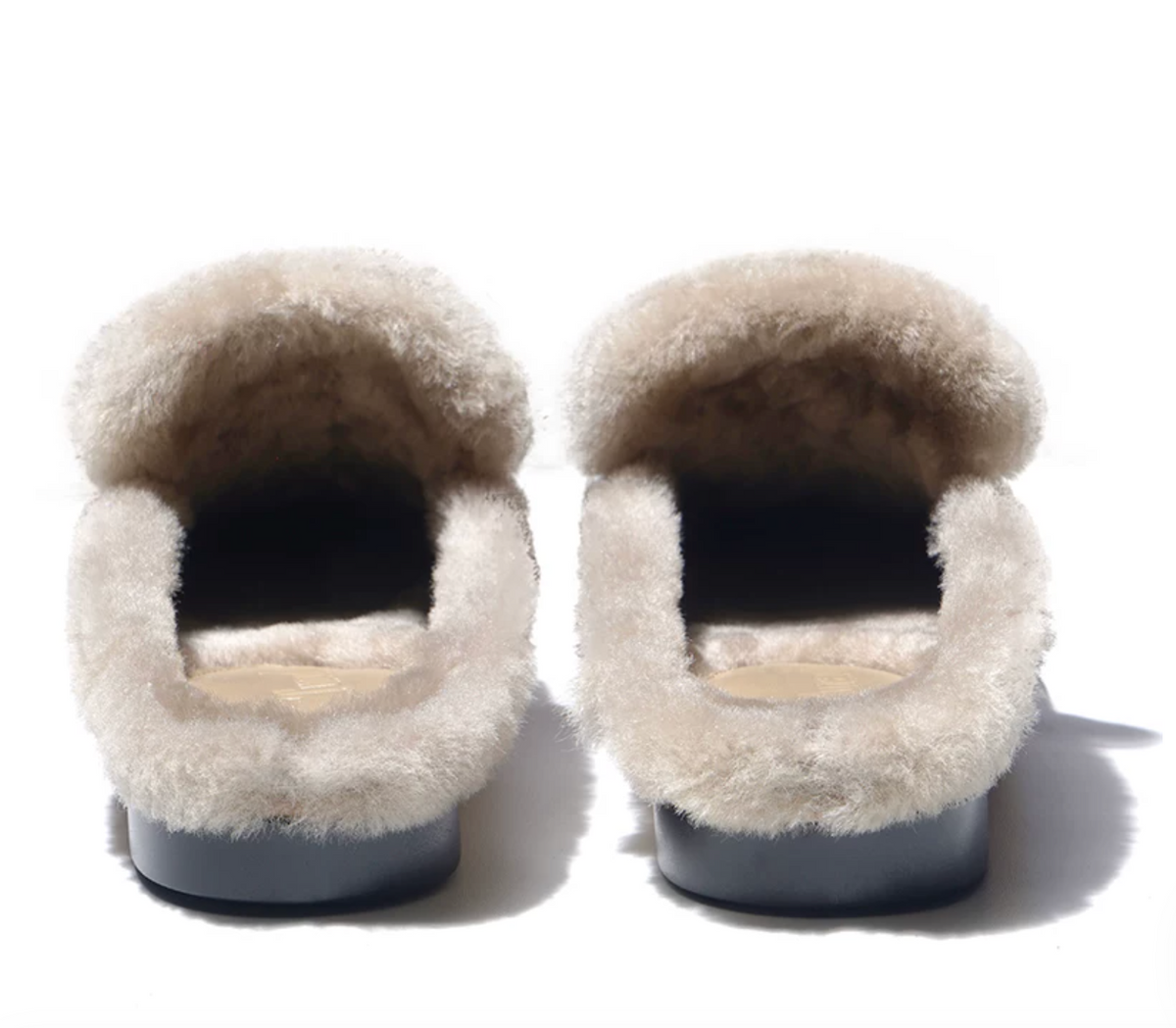 Back view of tan backless mules showing the plush shearling lining