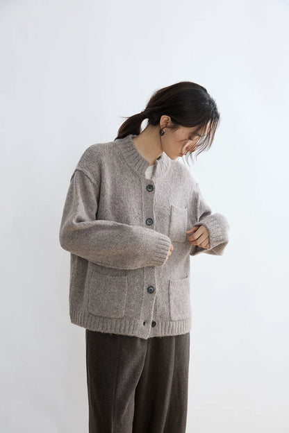Taupe alpaca wool cardigan, close-up of button placket and chest pocket