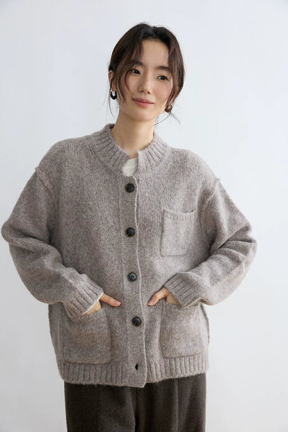 Taupe alpaca wool cardigan, close front view with pocket detail