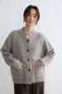 Taupe alpaca wool cardigan, close front view with pocket detail