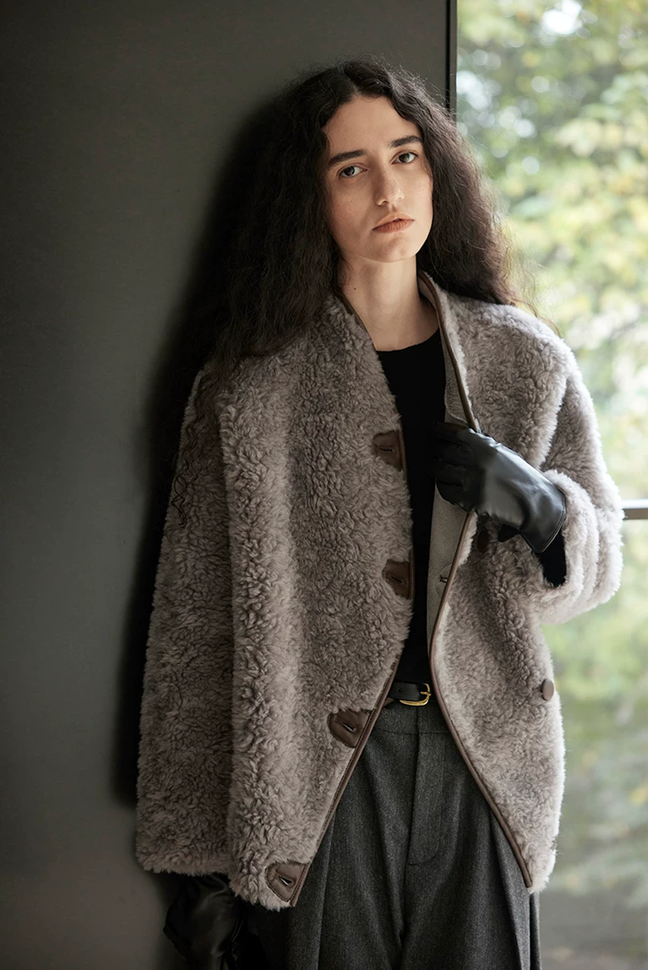 Taupe Gray wool teddy jacket worn partly open, showing the curved piped front edge