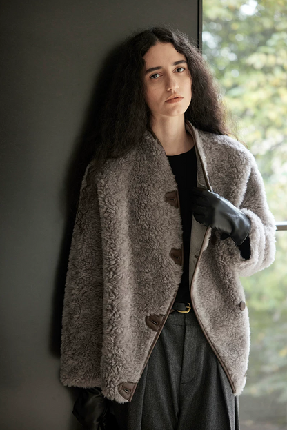 Taupe Gray wool teddy jacket worn partly open, showing the curved piped front edge