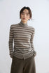 Taupe stripe yak wool turtleneck, front view on model