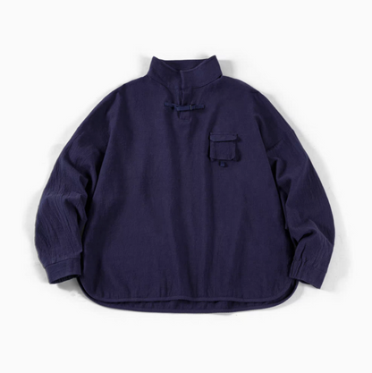 Blue textured cotton polo shirt flat lay front view featuring jacquard fabric, half-placket closure, and chest pocket detail