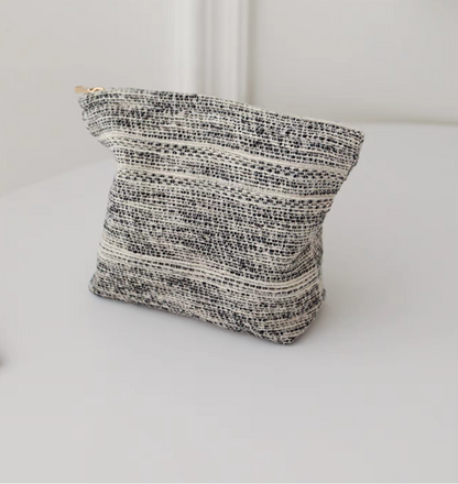 Back view of Textured Stripe Mini Cosmetic Zip Pouch in stripe pattern showing woven textured stripe design