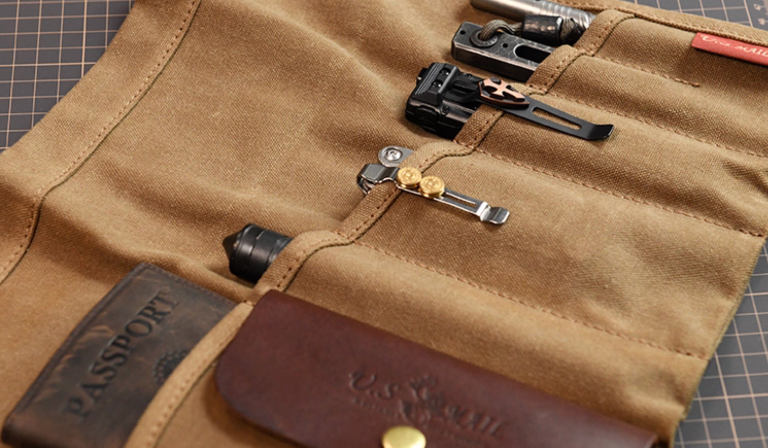 Waxed canvas Field Companion with leather pocket and organized EDC slots.