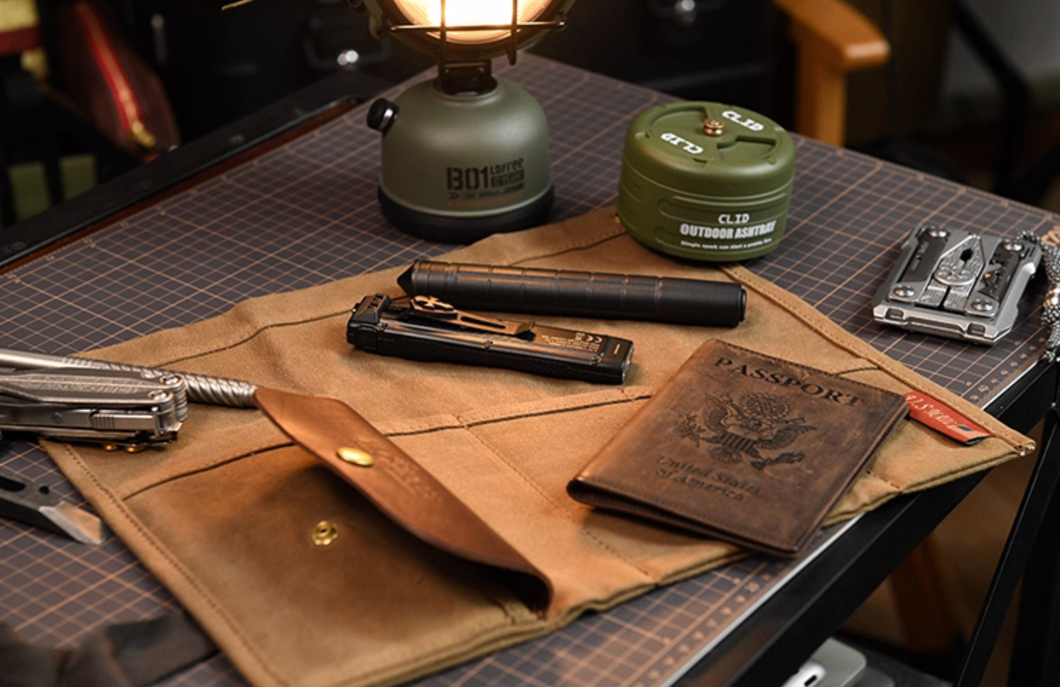 Open Field Companion canvas organizer showing multitools, flashlight, passport.