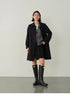 Timeless Trench Coat in Black full body front view showing mid-length straight fit, single-breasted design and classic silhouette
