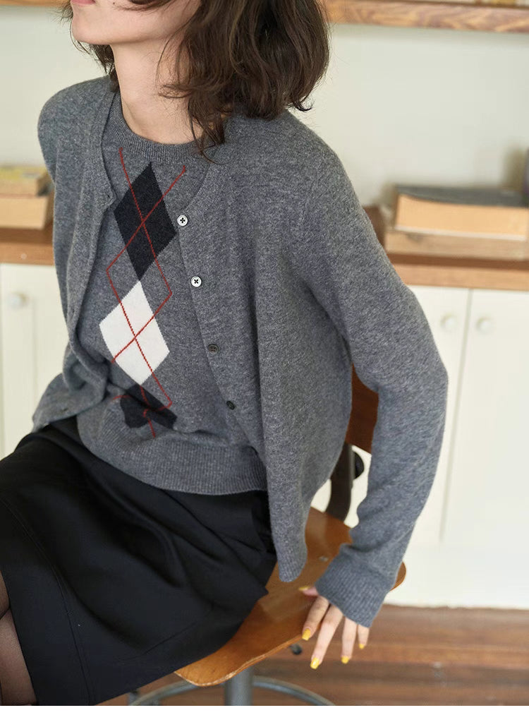 Close-up of light gray Timeless Wool Knit Vest showing diamond argyle pattern, ribbed hem and soft wool knit texture