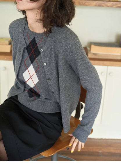 Close-up of light gray Timeless Wool Knit Vest showing diamond argyle pattern, ribbed hem and soft wool knit texture