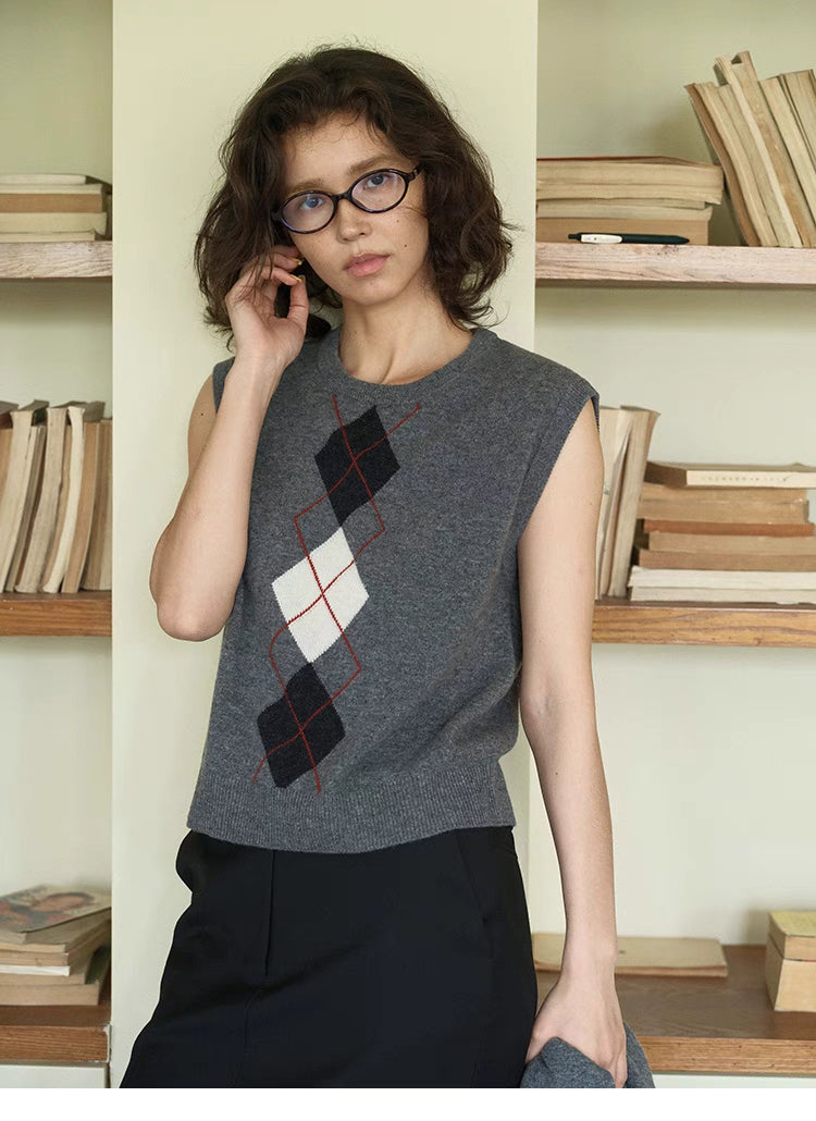 Timeless Wool Knit Vest in light gray, front view on model with classic diamond argyle pattern and sleeveless knit design