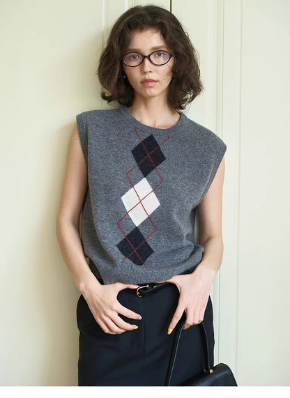 Light gray Timeless Wool Knit Vest styled with black skirt and belt, front view outfit with classic argyle knit pattern