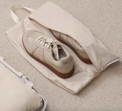 Travel Shoe Dust Bag in beige color opened flat with sneakers inside showing spacious protective storage design