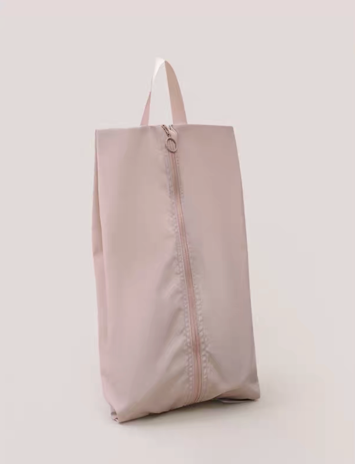 Travel Shoe Dust Bag in dusty pink color standing upright with soft tone finish for elegant and organized travel packing