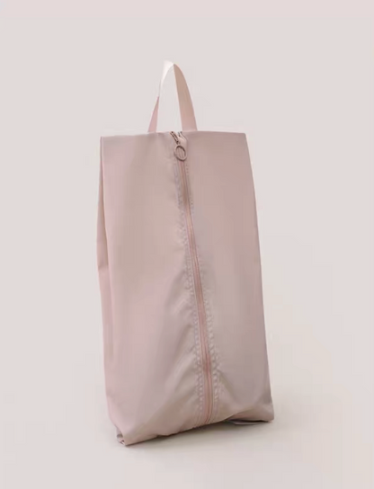Travel Shoe Dust Bag in dusty pink color standing upright with soft tone finish for elegant and organized travel packing