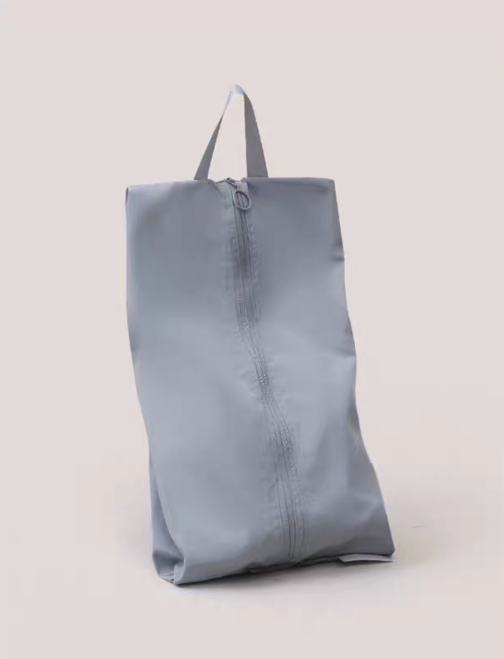 Travel Shoe Dust Bag in misty blue color upright display featuring smooth fabric and durable zipper with carry handle