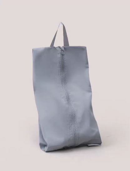 Travel Shoe Dust Bag in misty blue color upright display featuring smooth fabric and durable zipper with carry handle