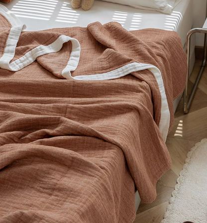 Light coffee ripple gauze cotton quilt close-up highlighting breathable three layer cotton texture.