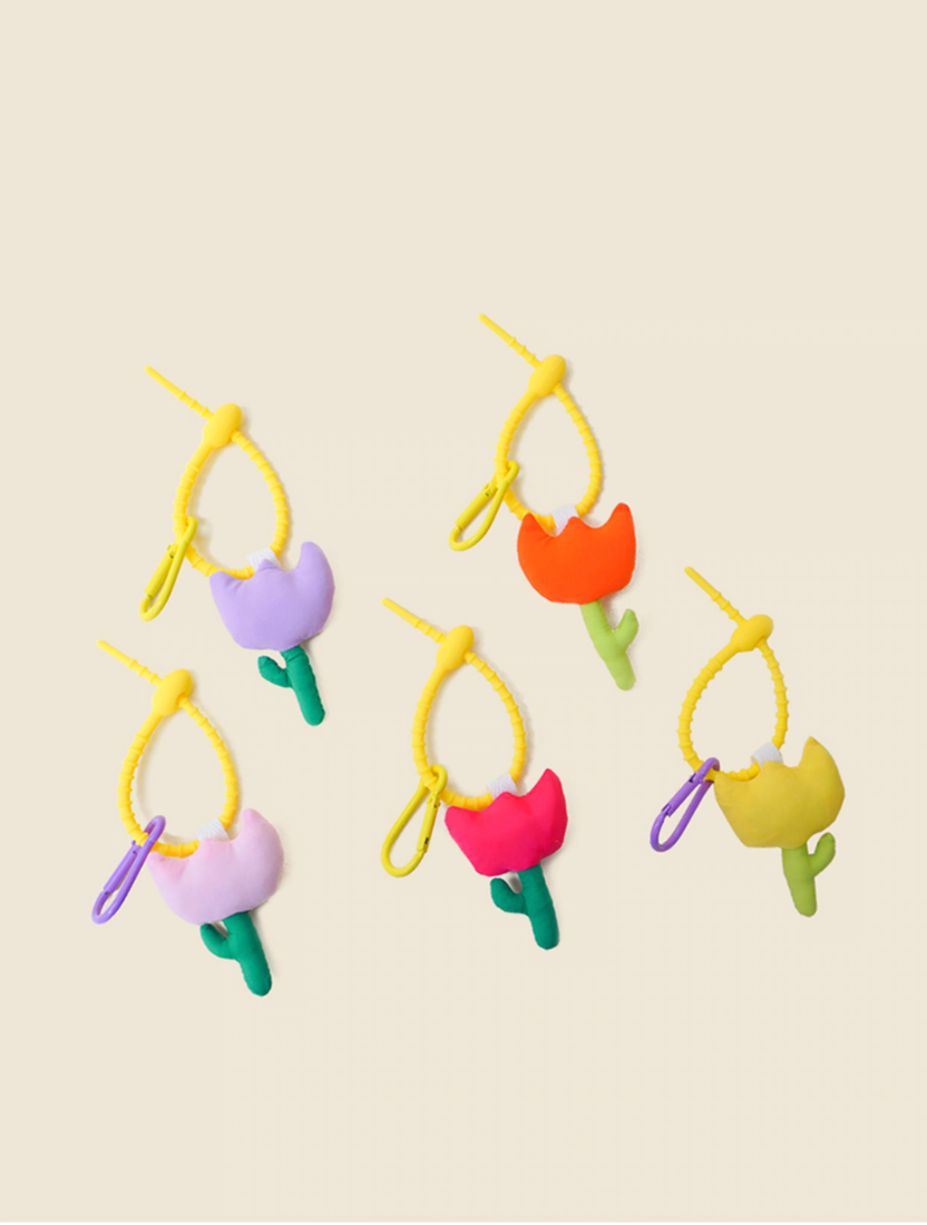 Tulip keychain charms in multiple colors including yellow orange pink fuchsia and purple shown together