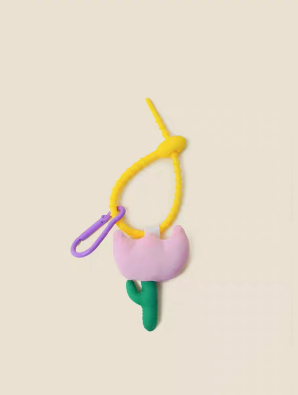 Pink tulip keychain charm front view with pastel flower shape and green stem detail