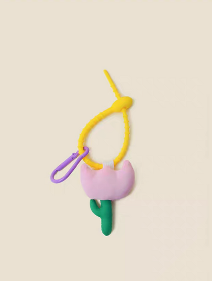 Pink tulip keychain charm front view with pastel flower shape and green stem detail