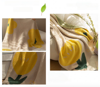 Tulip Luxe Blanket in tulip yellow shown in collage with multiple angles including draped chair view and floral pattern details