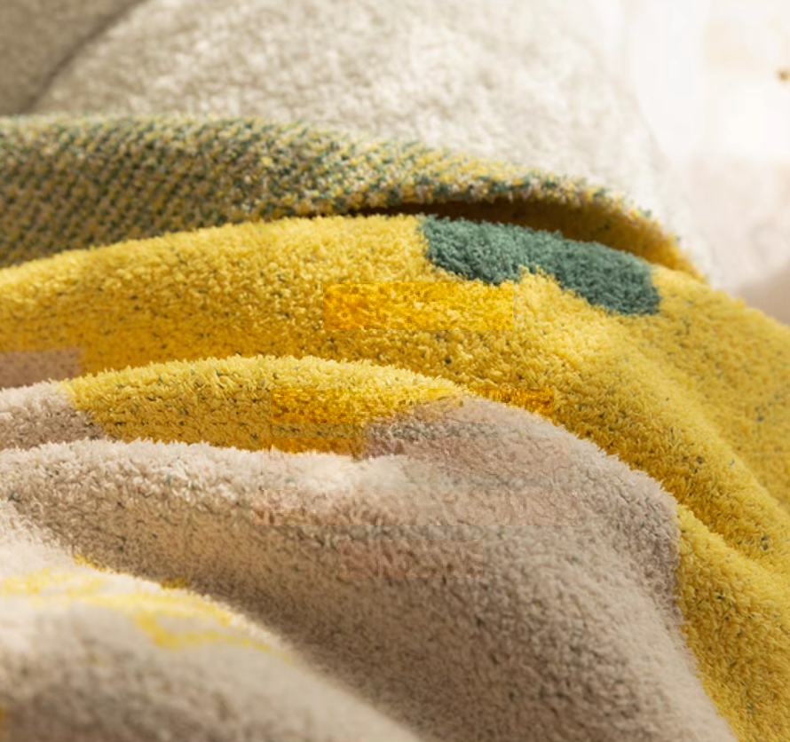 Detailed close-up of Tulip Luxe Blanket in tulip yellow highlighting thick plush fabric and soft textured fibers