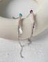 Turquoise baroque pearl bracelet with natural freshwater pearl and silver chain featuring turquoise accent detail on display