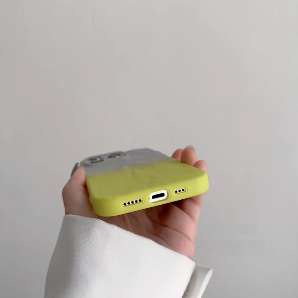 Gray and yellow phone case bottom detail with charging port and speaker openings