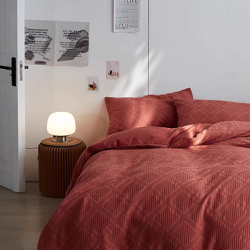 Red Ultra-Soft 60S organic cotton waffle weave bedding set styled in modern bedroom with textured duvet cover and matching pillow shams