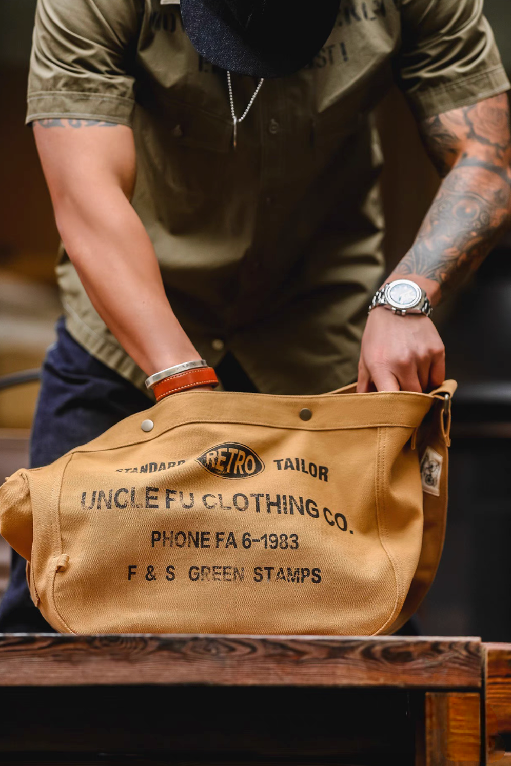 Close-up of Urban Cruiser apricot yellow canvas messenger bag being opened showing spacious interior and durable construction
