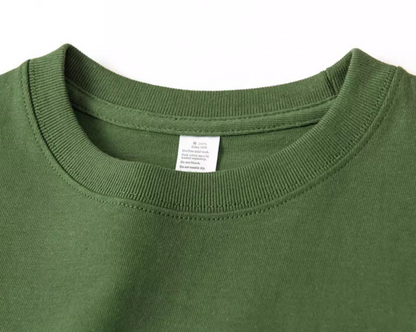 Urban Forest Tee avocado green crewneck collar close-up showing stitching and label detail