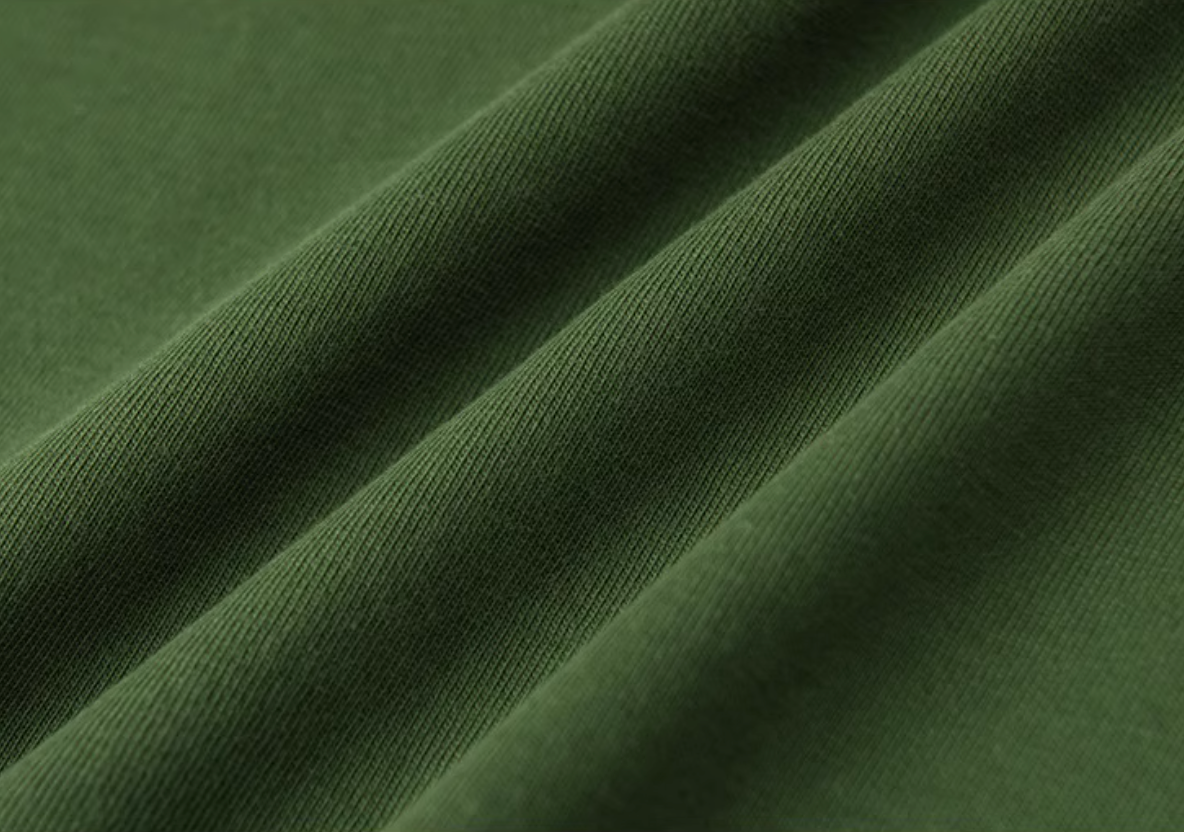 Urban Forest Tee avocado green cotton fabric close-up showing soft breathable texture detail